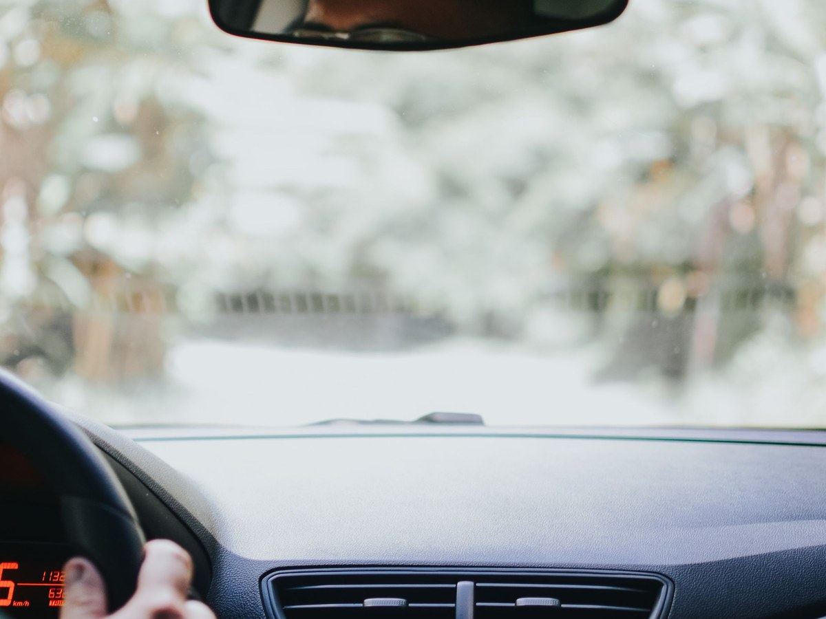 Driver hand on the steering wheel during a daily trip