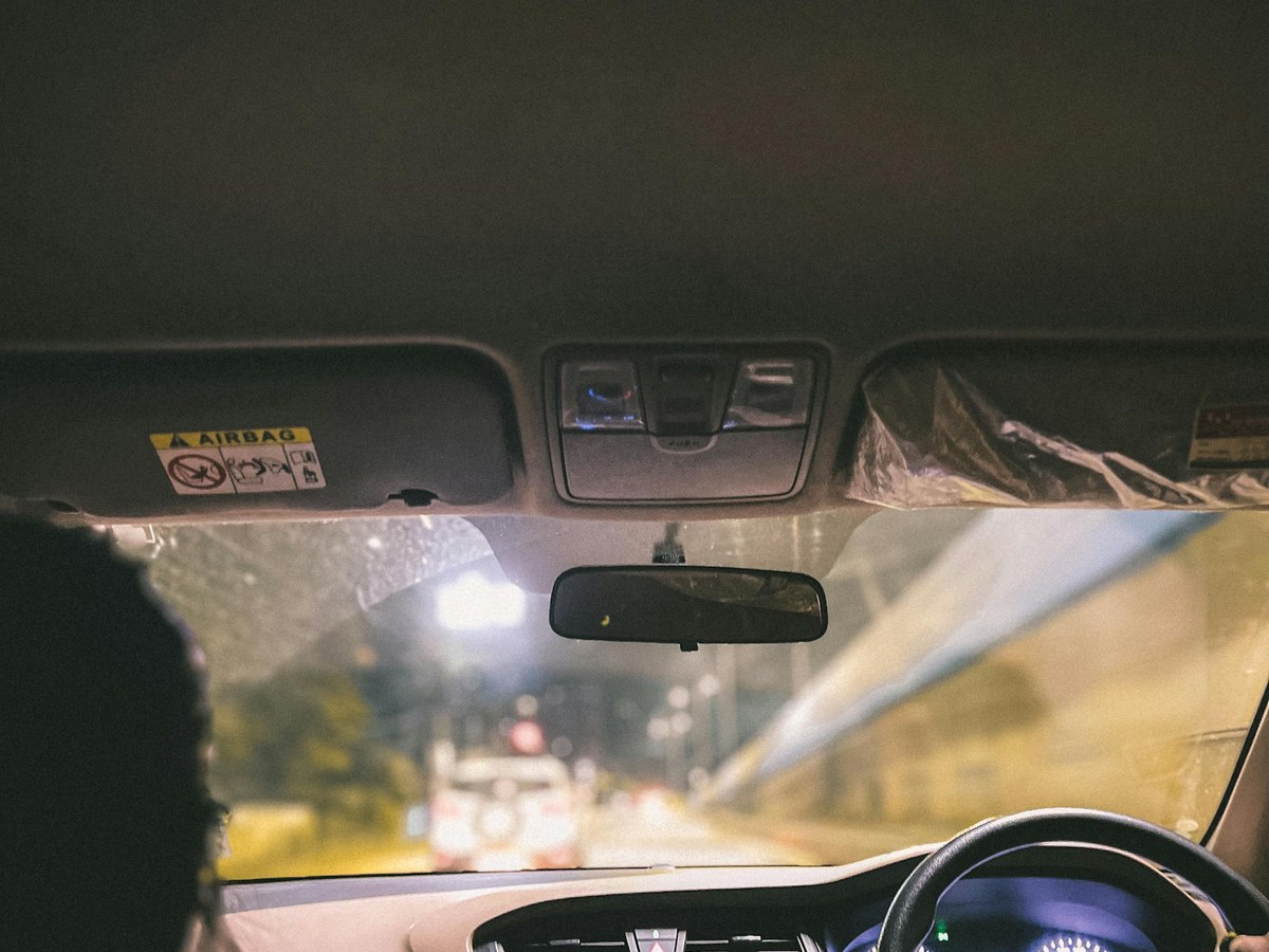 Driver checking road visibility from inside a car